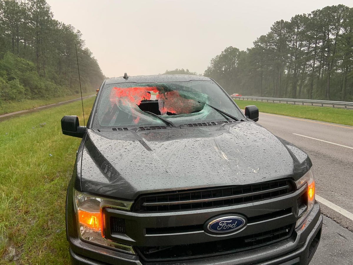 Lightning sends chunk of road flying into truck s windshield